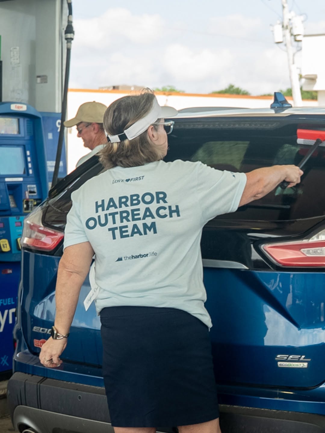Harbor Outreach Team member wearing a custom printed team T-shirt