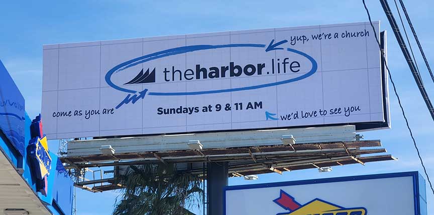 Close view of The Harbor billboard in Friendswood, printed by MusiGraphics