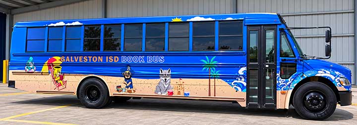 Galveston ISD Book Bus with full beach-themed vehicle wrap