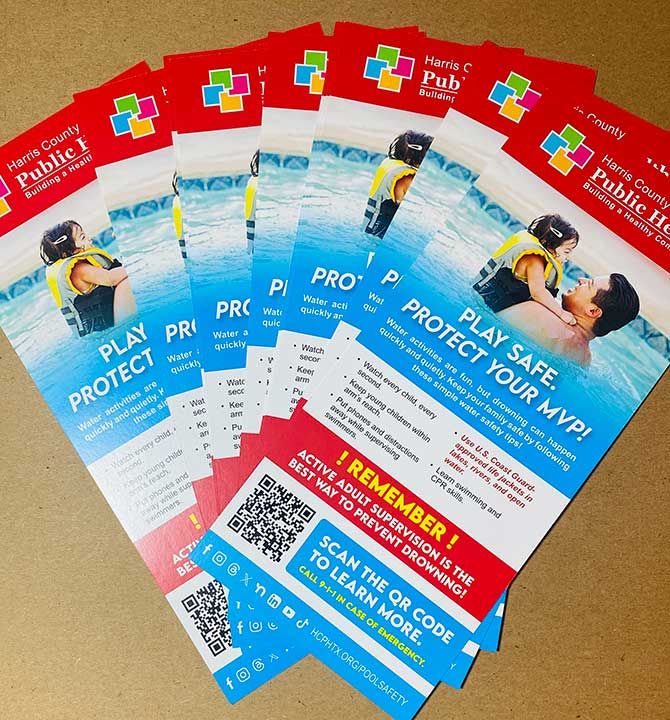 Finished Harris County Public Health printed rack cards displayed in a fan arrangement
