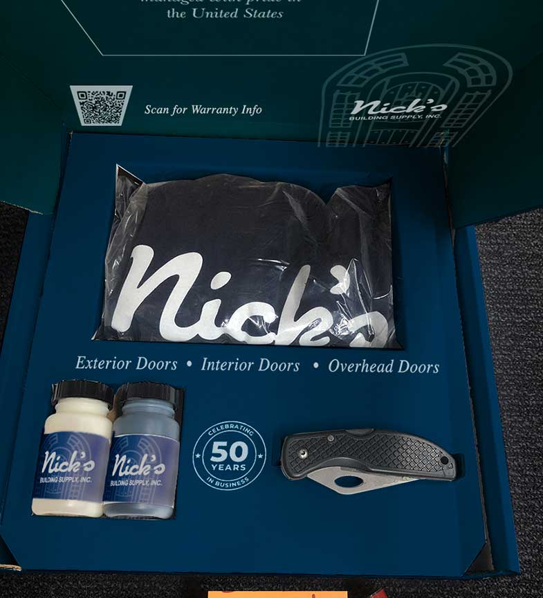 Open Nick’s Building Supply customer package with branded interior, printed T-shirt and included items